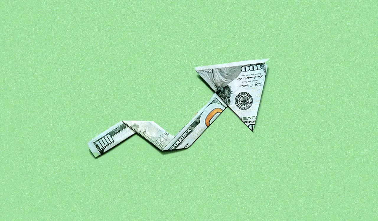a folded dollar bill arrow